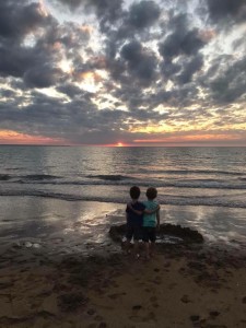 boys looking at sunset